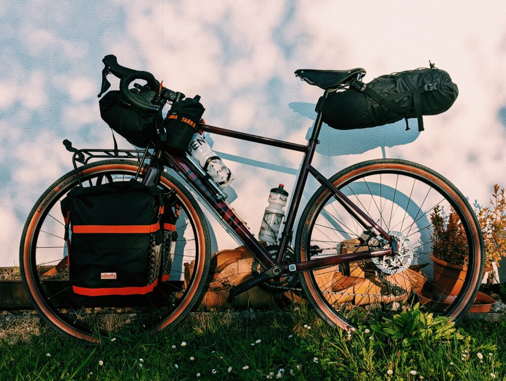 My bike with all touring bags attached leaned against a wall