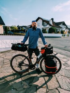 Me with a fully loaded touring bike standing in a drive way