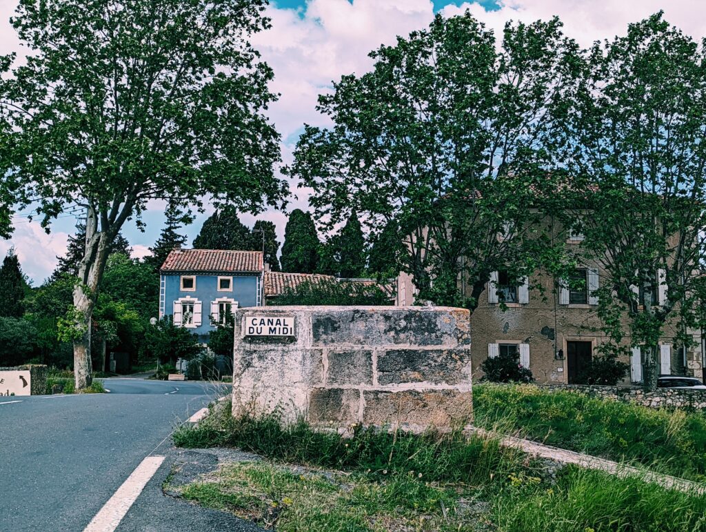 Bridge with old sign saying "Canal du Midi"