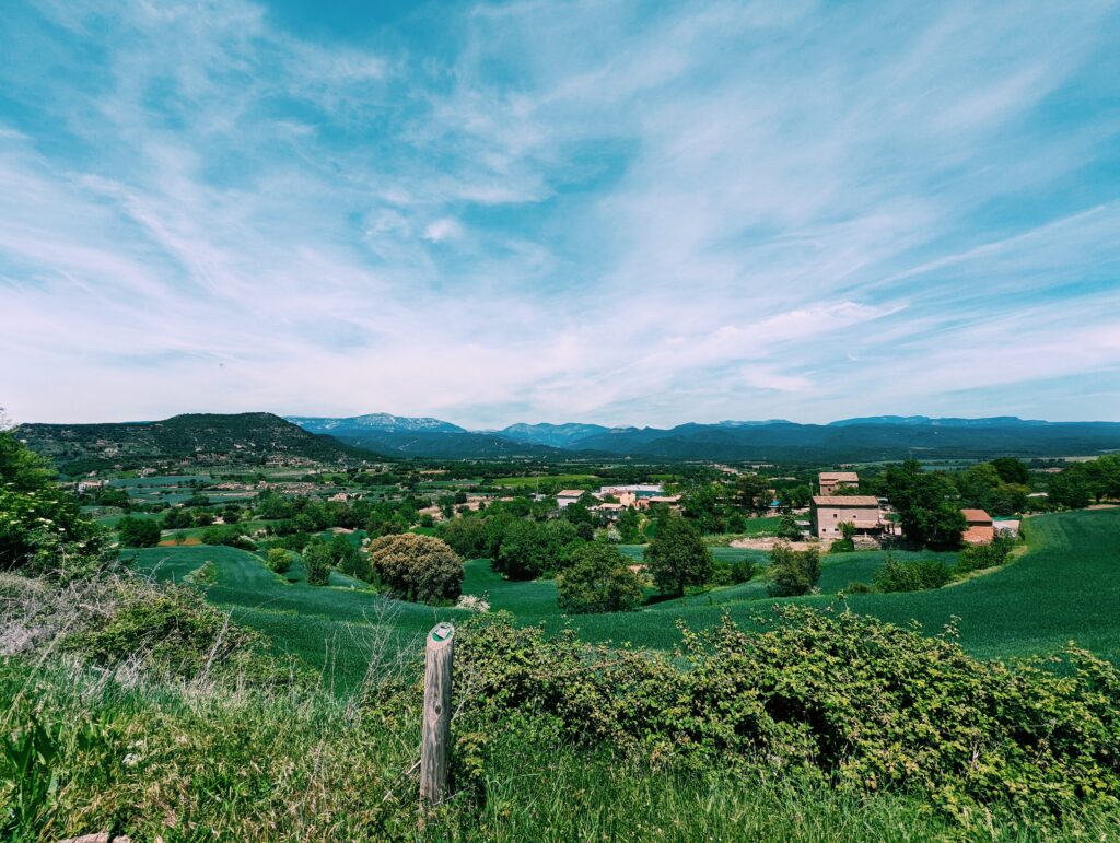 View north from Solsona with old farms in the middleground and Pyrenean hills in the background