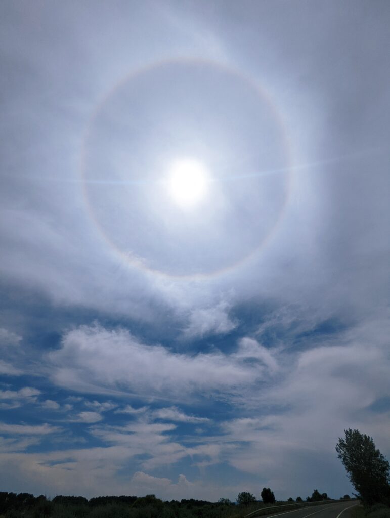 Halo around the sun in cloudy sky